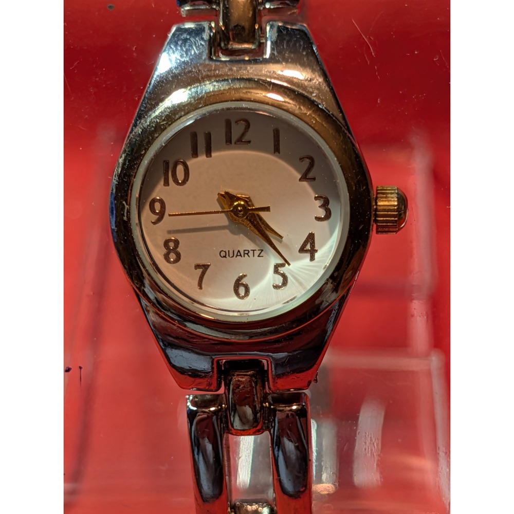 women's two-tone analog quartz watch. NOT WORKING NEEDS BATTERY OR MORE